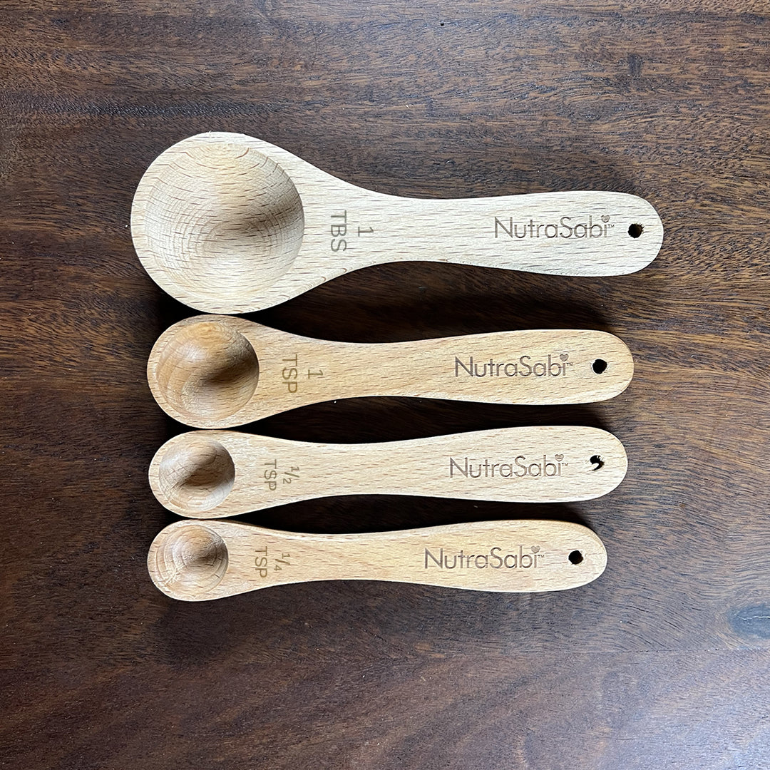 Wooden measuring spoons showing measurements