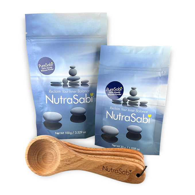 Two packages of NutraSabi with a wooden scoop on a white background