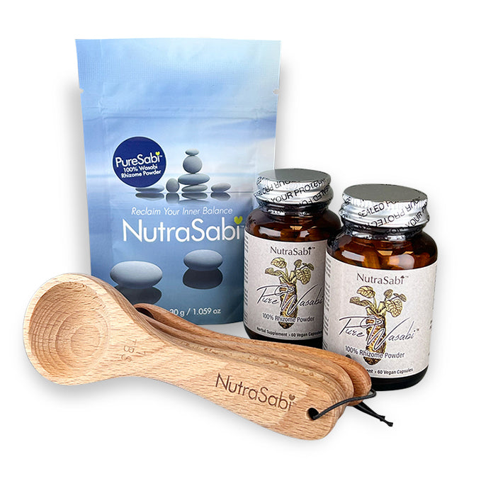 NutraSabi products including powders and capsules with a wooden spoon set on a white background